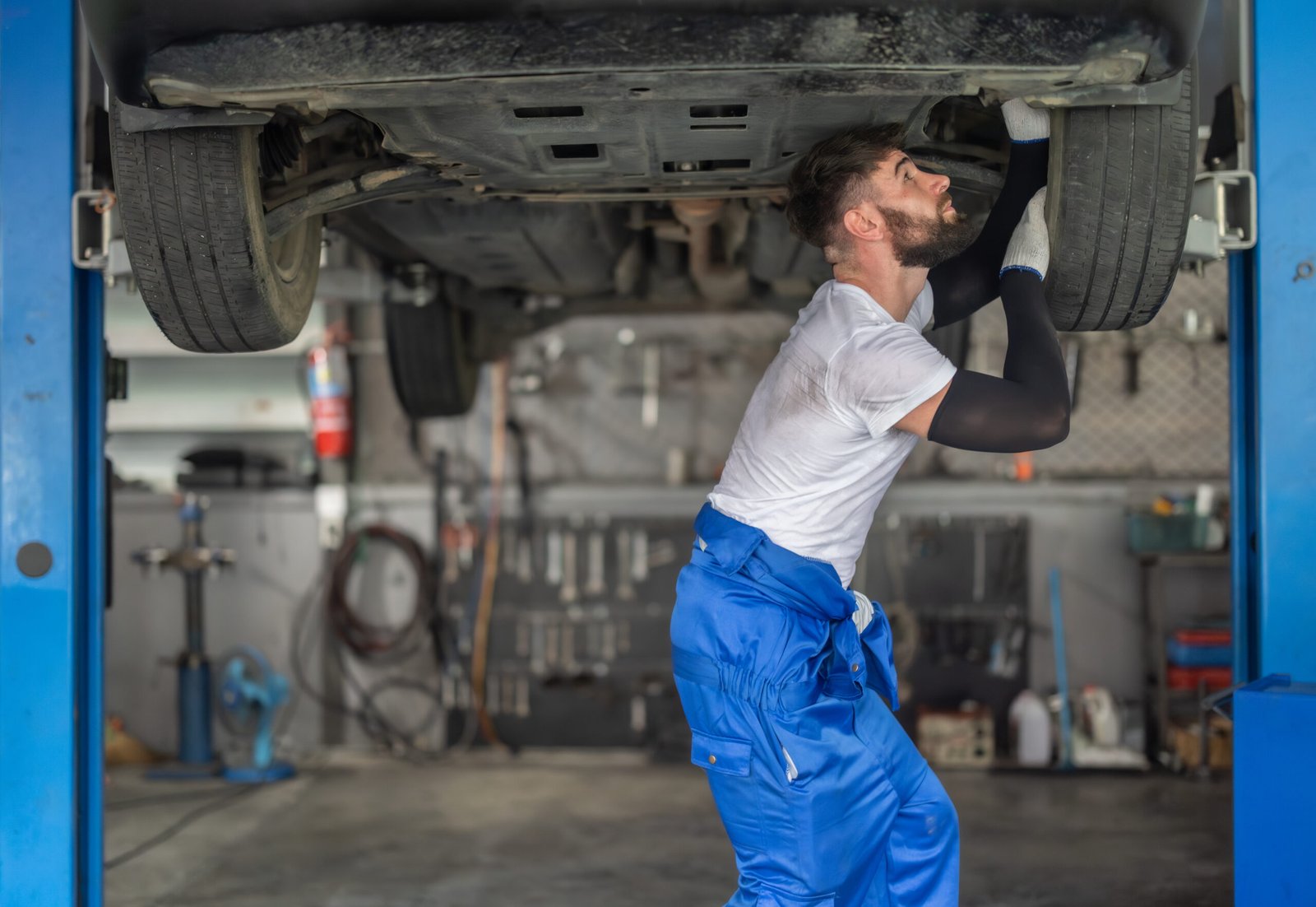 mechanic-inspecting-car-undercarriage-at-repair-sh-2026-03-16-04-28-20-utc-scaled.jpg