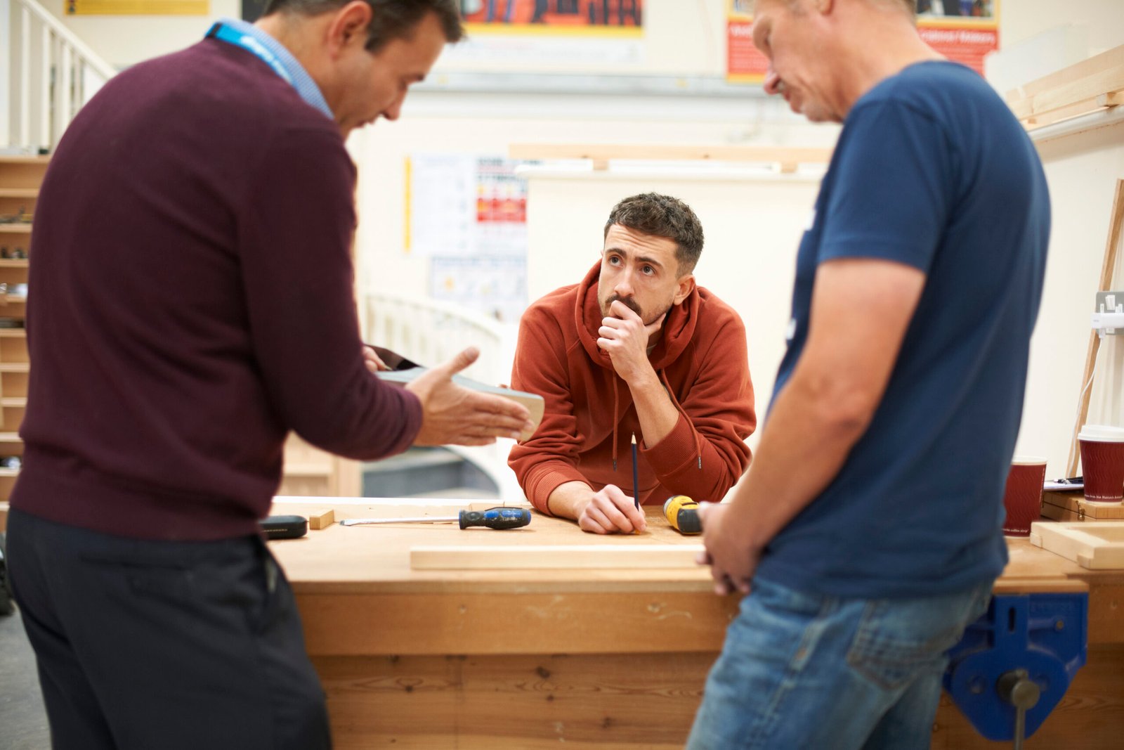men-in-a-woodworking-class-discussing-a-project-2026-03-25-01-20-03-utc-scaled.jpg